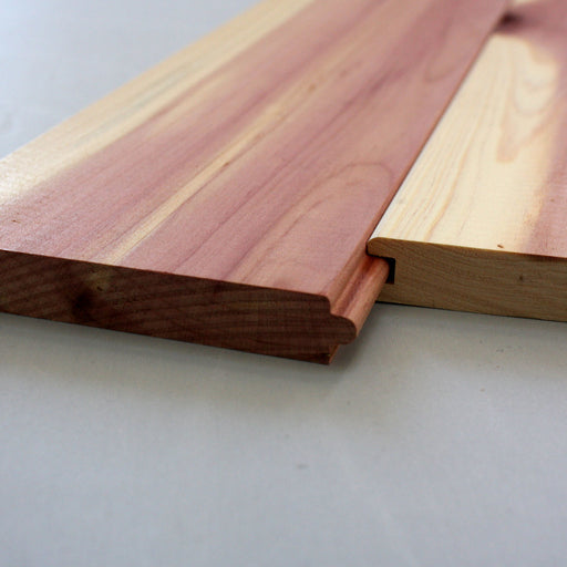 A close-up of Aromatic Red Cedar tongue and groove siding showing the detailed edge profile.