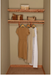 Clothing hanging on an aromatic cedar wooden shelves against a beige wall.