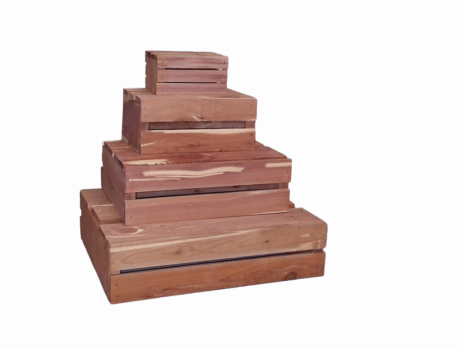 Set of wooden boxes of different sizes stacked as a display on a white background